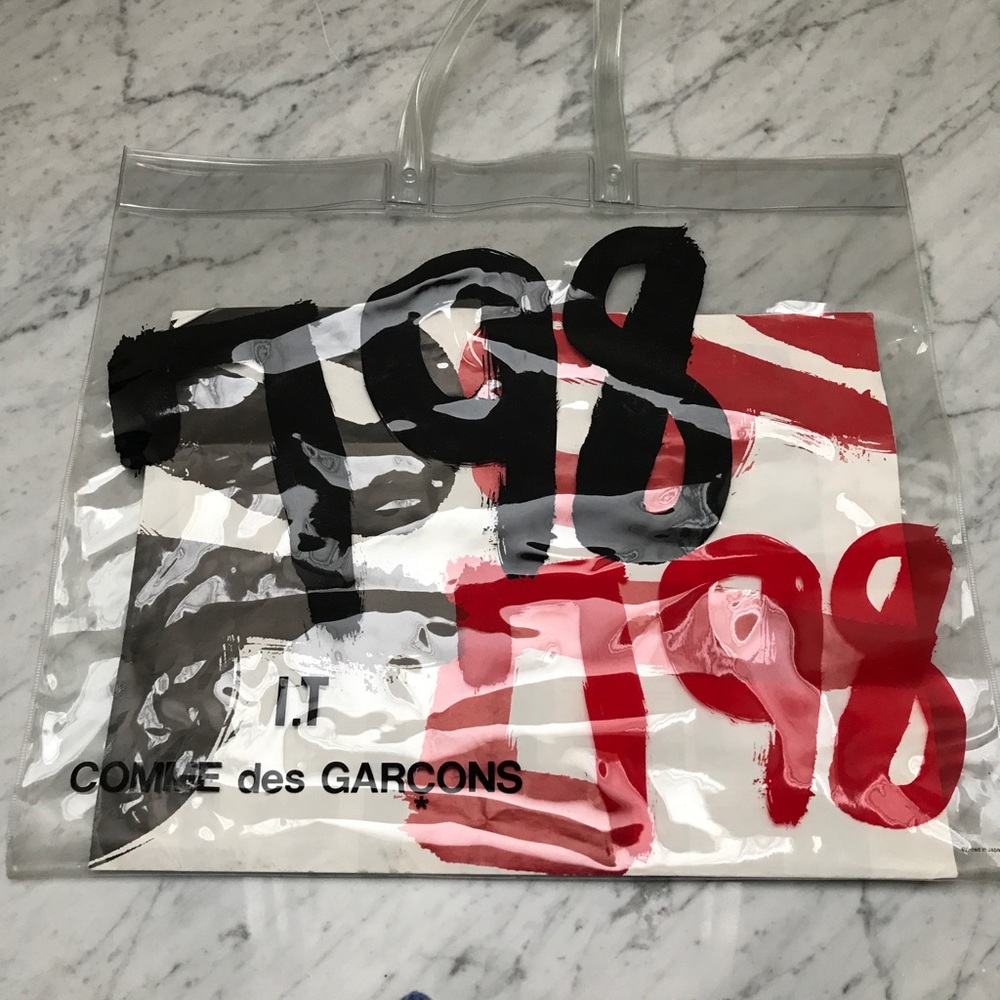 Comme des Garçons bag with poster